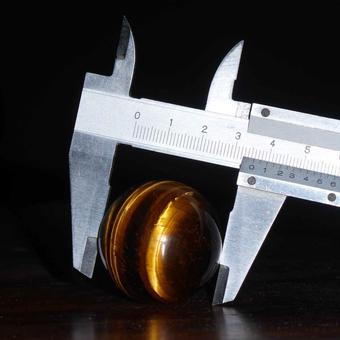 A caliper measures to 0.1 mm between its jaws. Read the main scale, then the fine scale.