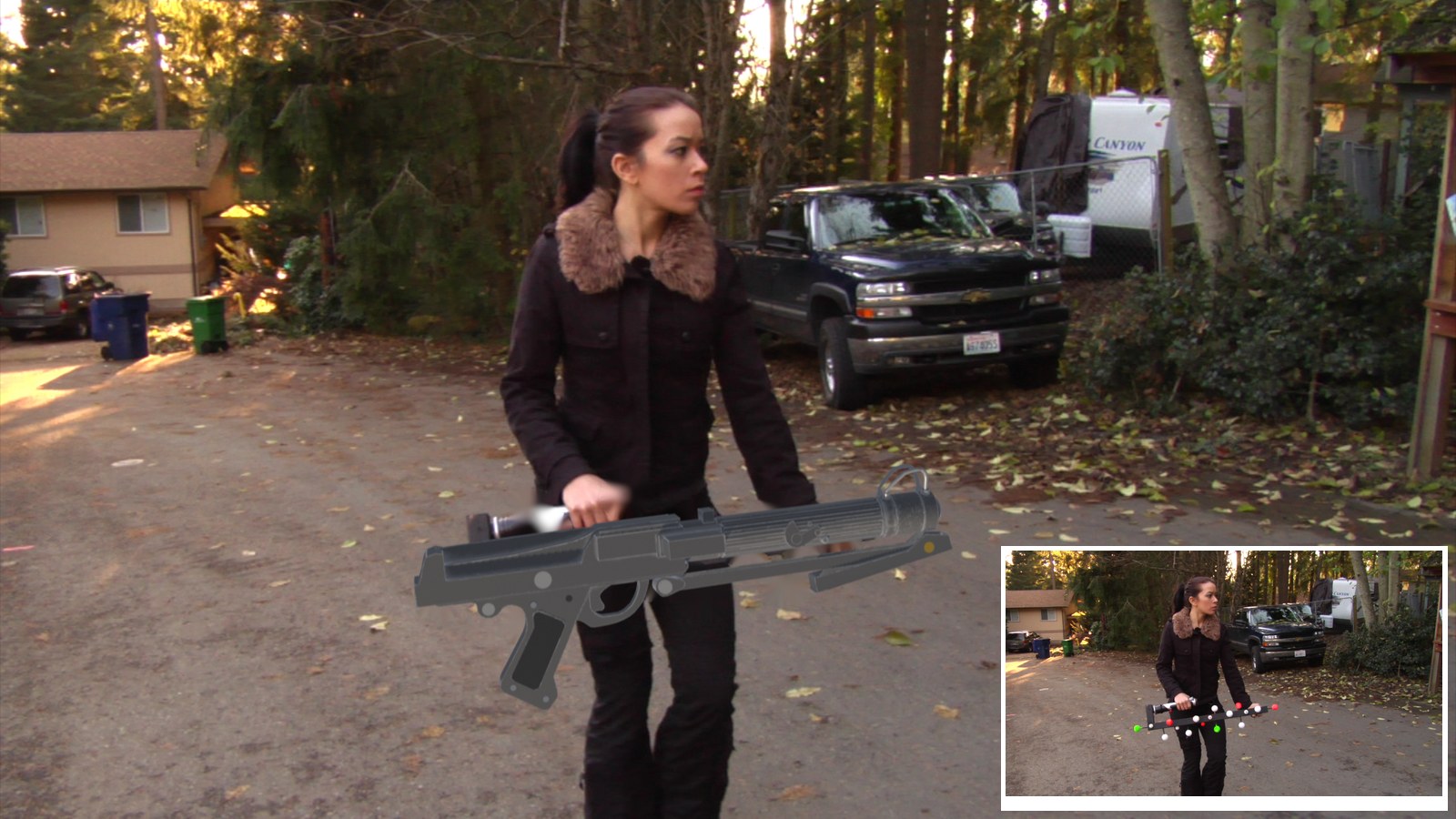 A woman walks down a driveway carrying a 3D blaster rifle in both hands; an inset shows the original plate with a bar covered in tracking balls