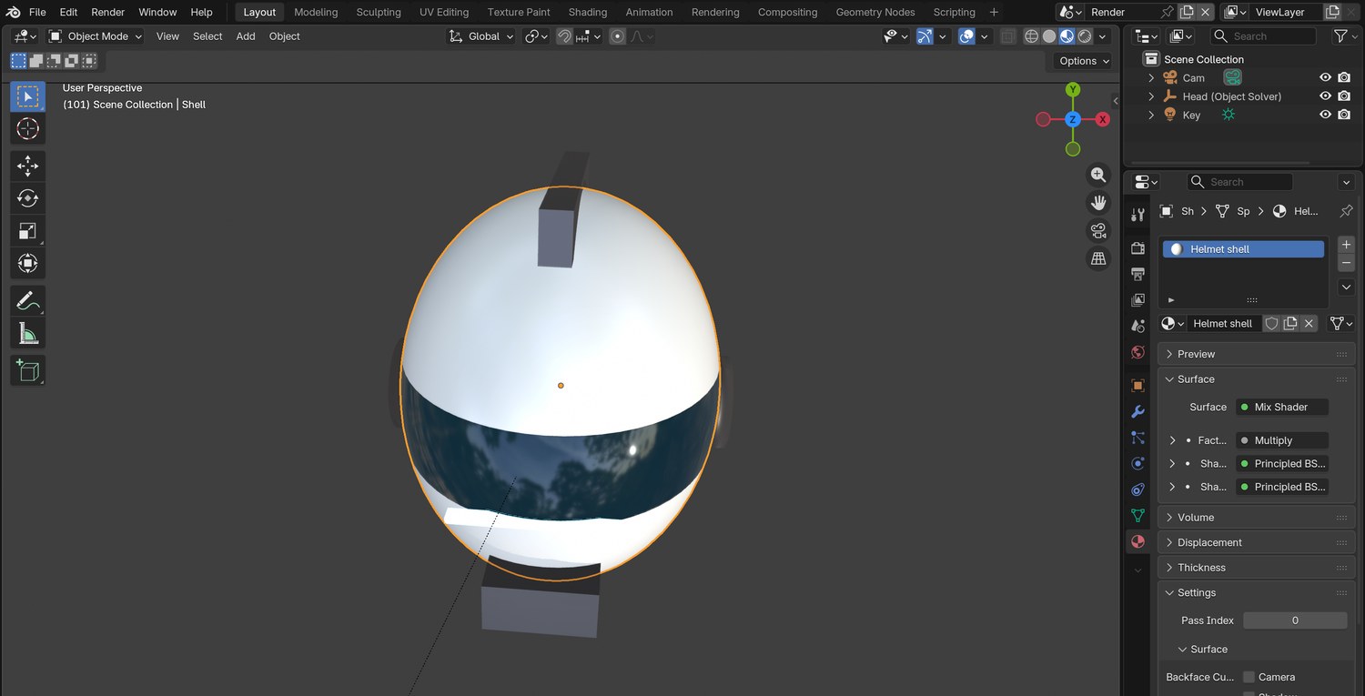 Real screenshot: the demo helmet in Blender. One sphere scaled to a head shape, a visor made in the material, a crest, ear caps and a chin vent.